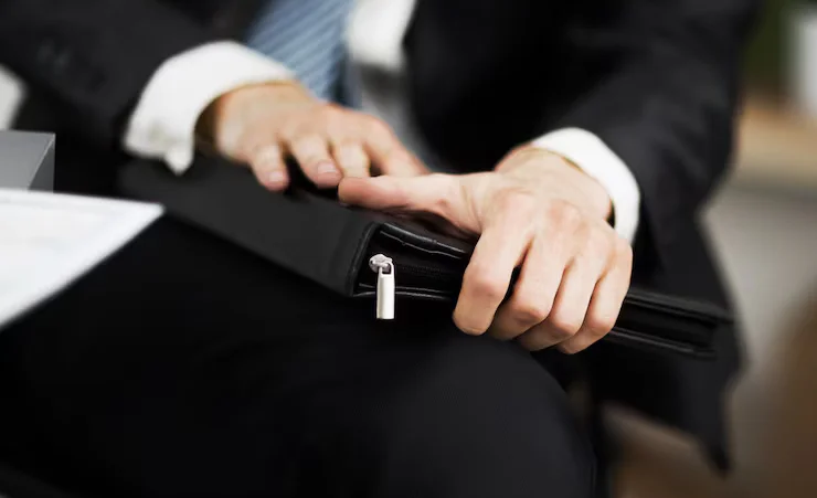 confident-businessman-with-folder-his-hands-office_160672-13841.avif