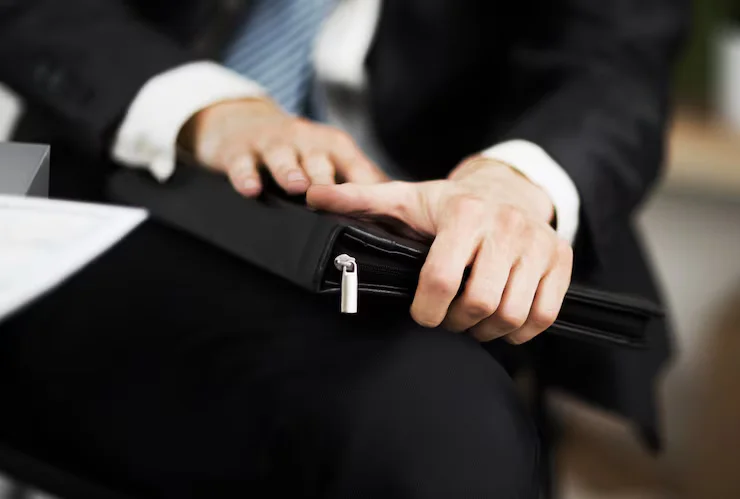 confident-businessman-with-folder-his-hands-office_160672-13841.avif
