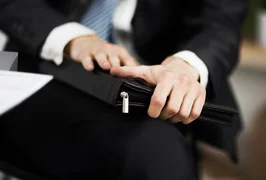 confident-businessman-with-folder-his-hands-office_160672-13841.avif