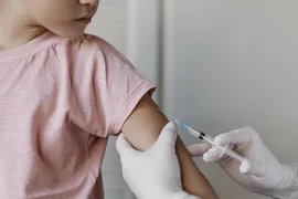 doctor-administering-a-vaccine-to-kid.jpg
