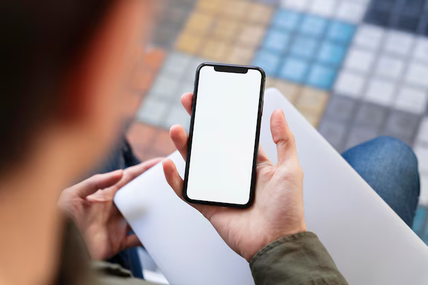 top-view-man-looking-his-phone-with-empty-screen_23-2148690638.avif
