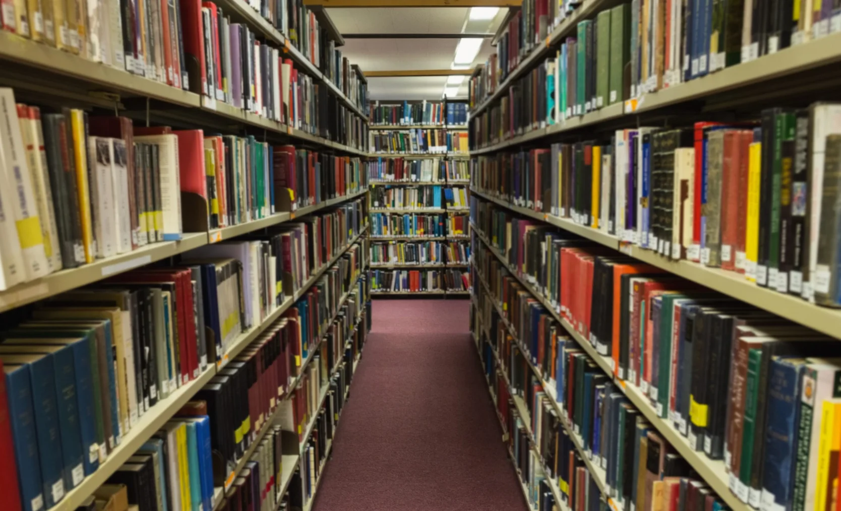 volumes-books-bookshelf-library-scaled.jpg