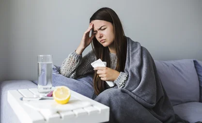woman-on-couch-with-medication-scaled.jpg